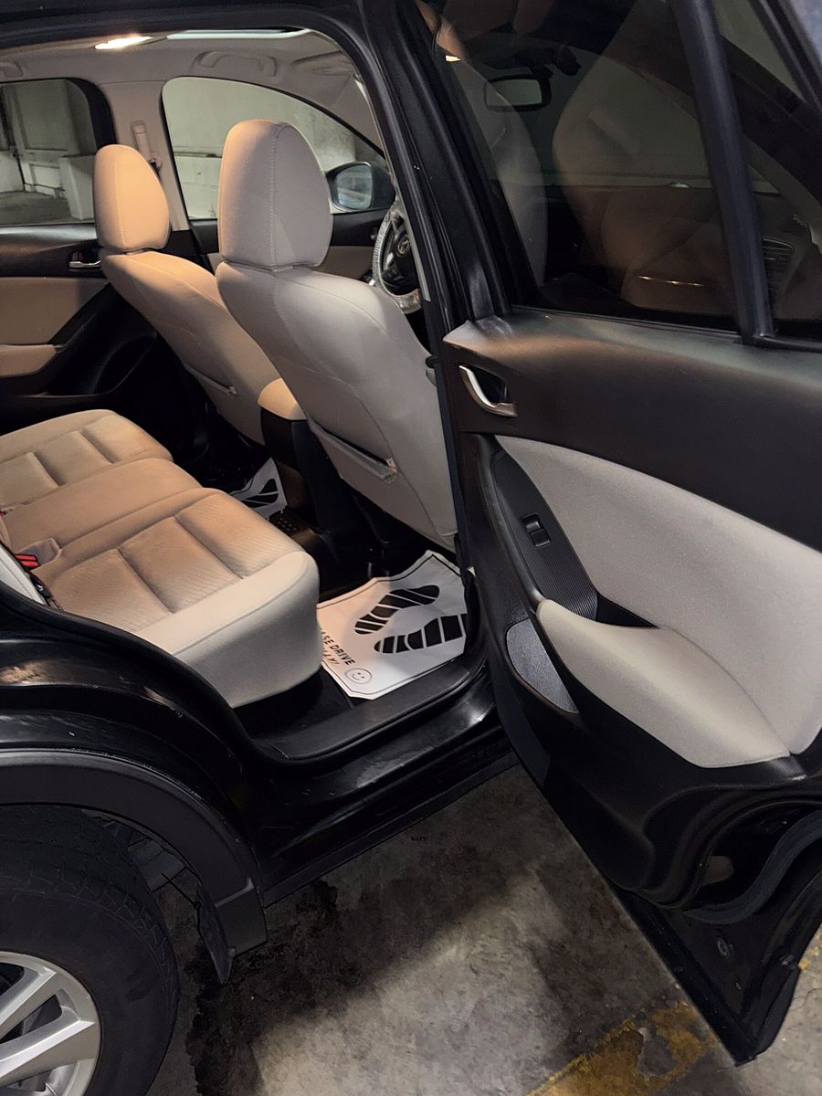 Empty, freshly cleaned back seat seen through an open door